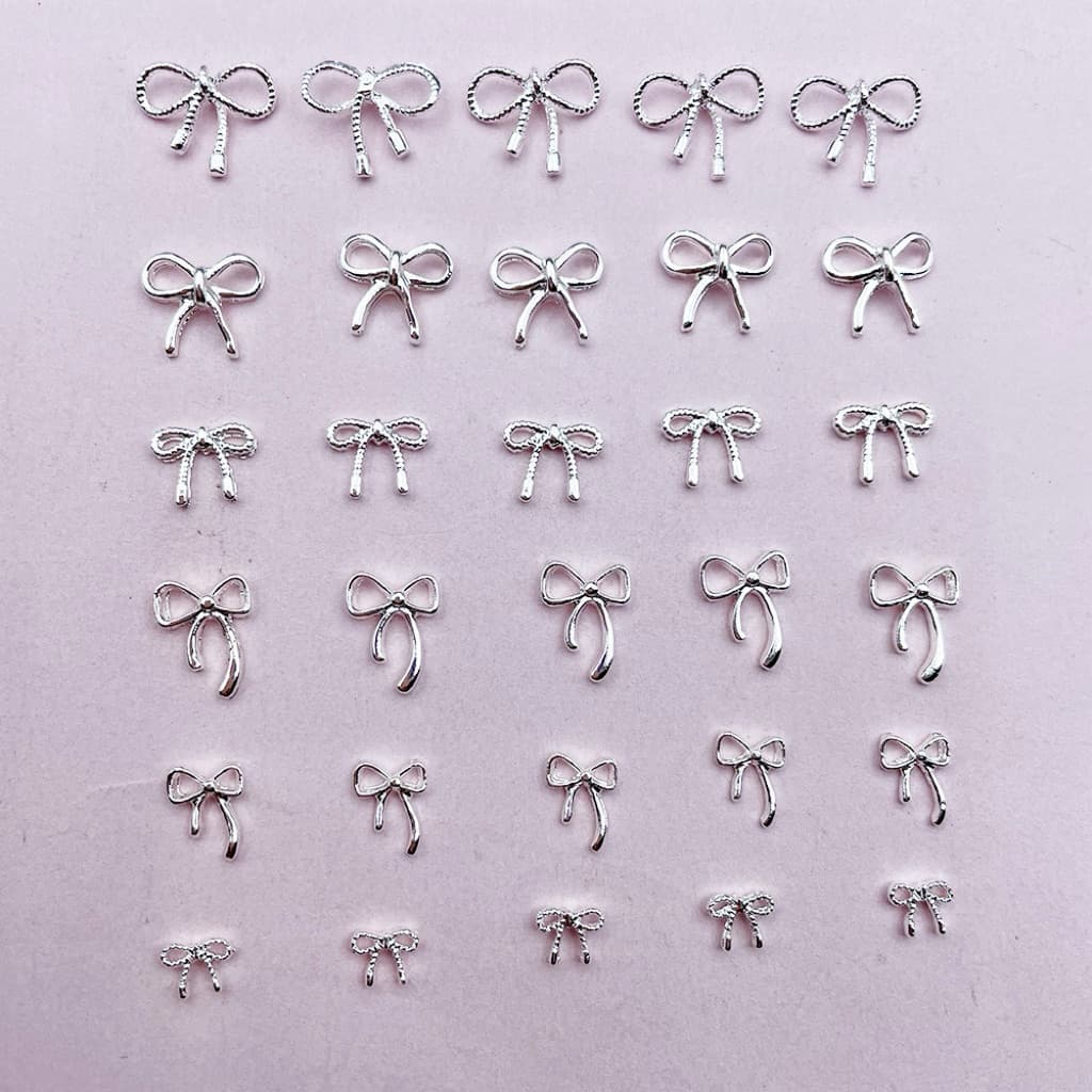 อะไหล่โบว์เงิน ตกแต่งหน้าเล็บ ติดของอเนกประสงค์ 10 ชิ้น/ห่อ สินค้า รูปที่ 1