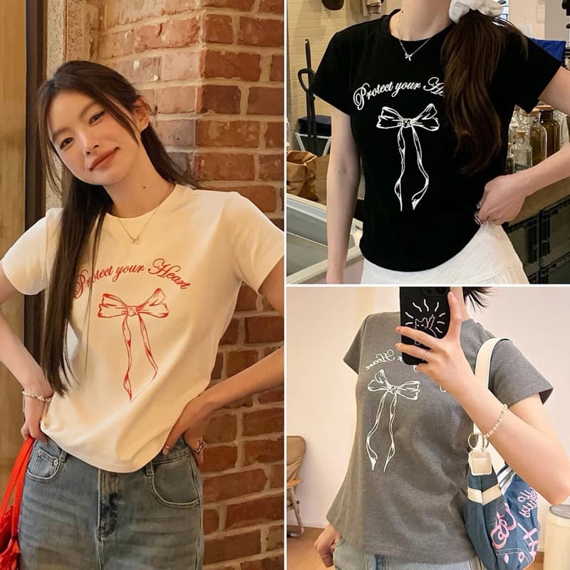 STR เสื้อยืดผู้หญิงสีขาว เสื้อรัดรูป เสื้อครอปแฟชั่นแขนสั้น พิมพ์ลายโบว์น่ารัก คอกลม สไตล์เกาหลี สาวอ้วนใส่ได้ รูปที่ 1